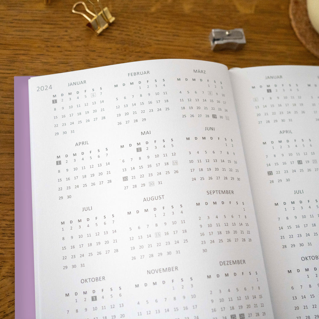 A5 Terminkalender - Kalender ohne Jahr quer | Wochenplaner und Achtsamkeit Notizbuch | Softcover Taschenkalender & Terminplaner | Violett Lila Weiß